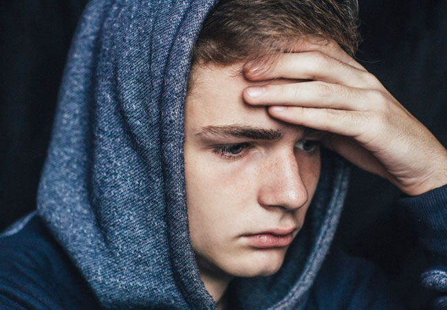 Young person looking sad