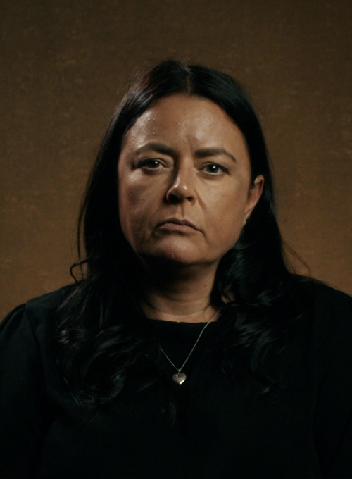 A head and shoulders portrait of a sad mum who lost her son to knife crime