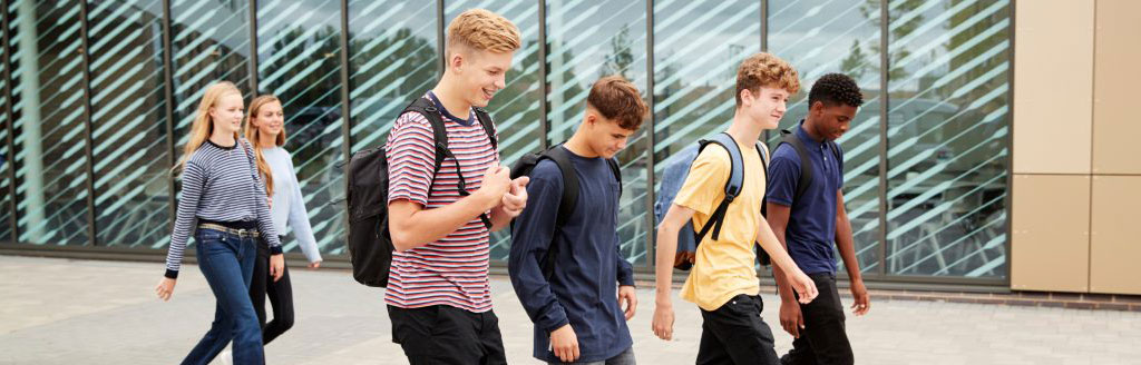 Student walking outside chatting